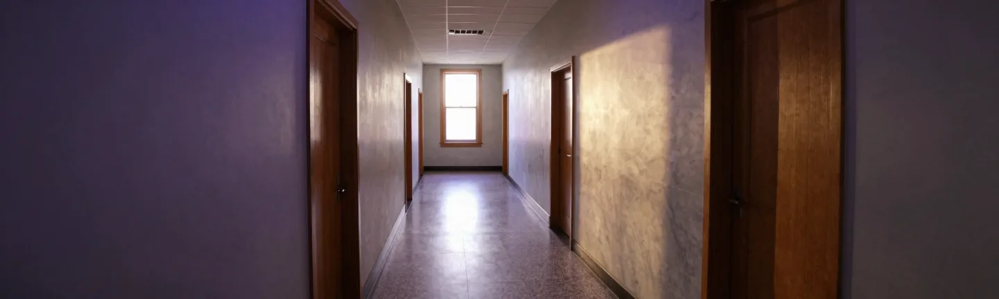 A courthouse hallway receding into the distance.