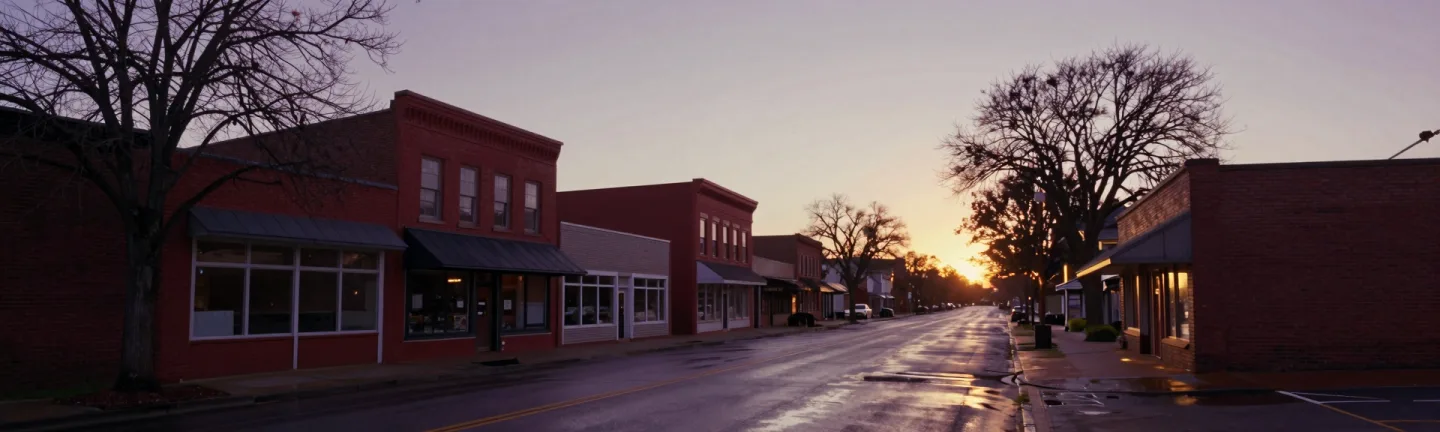 An empty main street at dawn in a wide panorama.